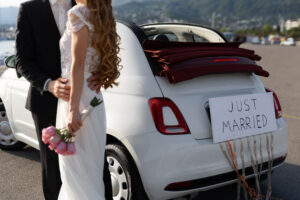 Couple next to car - just married