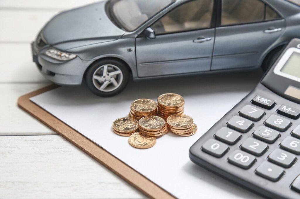 Car, coins, and calculator